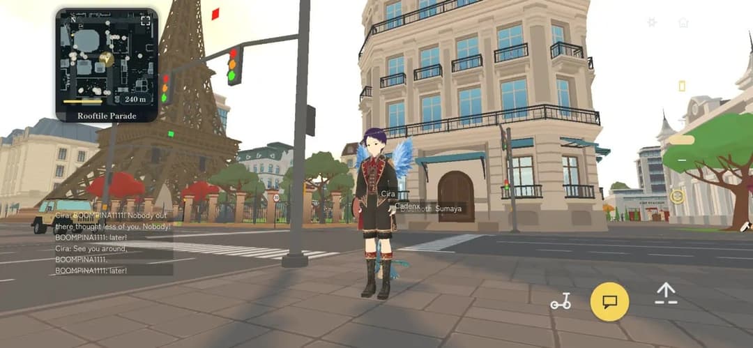 A player avatar with blue feathered wings stands on a Paris street in the Pikuball open world, the Eiffel Tower and low-poly apartment blocks behind, with a minimap in the top-left corner and player chat messages overlaid at bottom-left.